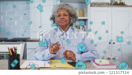 Image of network of connections with icons over senior african american woman having image call 121317314
