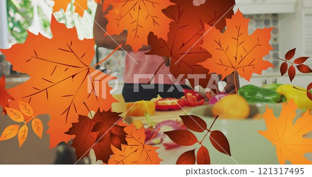 Image of frame with fall leaves over african american woman cutting vegetables 121317495