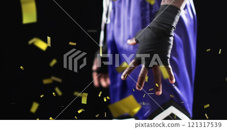 Image of confetti falling over african american male boxer on black background Image of confetti falling over african american male boxer on black background 121317539