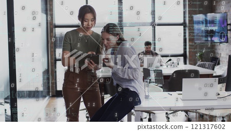 Image of binary coding data processing over diverse business people in office Image of binary coding data processing over diverse business people in office 121317602