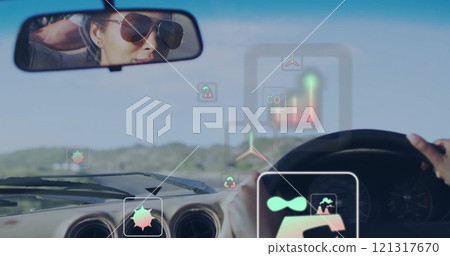 Image of eco icons over biracial woman driving car Image of eco icons over biracial woman driving car 121317670