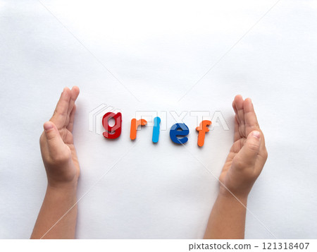 Children coping with grief. Colorful letters and hands expressing emotion 121318407