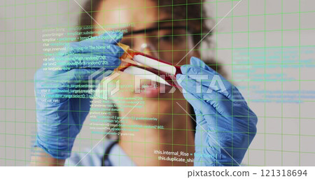 Analyzing blood sample, scientist with blue gloves over programming code image Analyzing blood sample, scientist with blue gloves over programming code image 121318694
