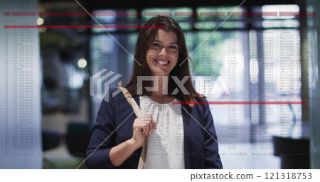 Business data analysis image over woman walking in office building Business data analysis image over woman walking in office building 121318753