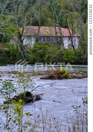 house by the Saja River in Cabezon de la Sal, Cantabria, Spain. 121319232