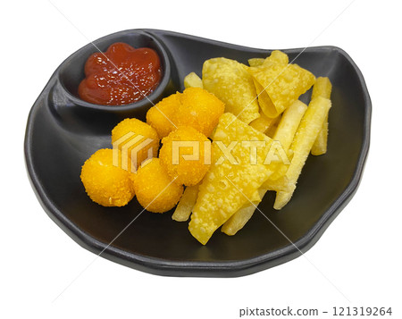 A black plate featuring a variety of fried snacks, including crispy golden potato balls, fried wonton chips, and french fries. A small section holds tomato ketchup for dipping. A black plate featuring a variety of fried snacks, including crispy golden potato balls, fried wonton chips, and french fries. A small section holds tomato ketchup for dipping. 121319264