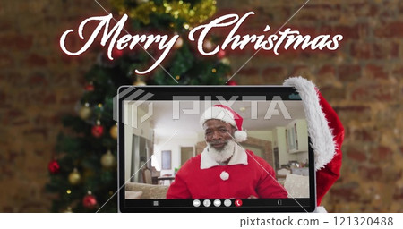 African American man dressed as Santa Claus on a video call, with copy space African American man dressed as Santa Claus on a video call, with copy space 121320488