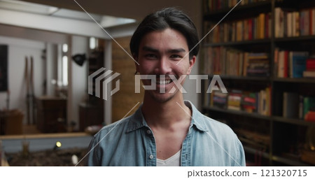 Portrait of happy, handsome biracial man with short dark hair enjoying time at home, standing in his Portrait of happy, handsome biracial man with short dark hair enjoying time at home, standing in his 121320715