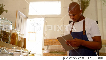 Male stuff checking stocks in supermarket 121320801