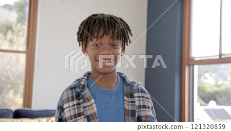 Portrait of happy african american boy at home, slow motion 121320859