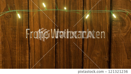 Image of frohe weihnachten text and fairy lights on wooden background 121321236