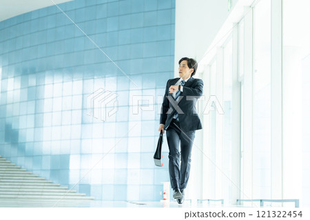 Running businessman Running businessman 121322454