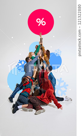 Enthusiastic shoppers raising their hands toward bold red percentage sign, surrounded by snowflakes and winter-themed graphics. 121322880
