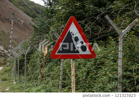 Warning sign near the border between Iran and Azerbaijan indicating landslide risk Warning sign near the border between Iran and Azerbaijan indicating landslide risk 121323823