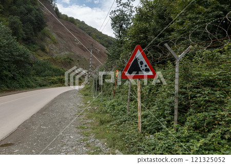 Border area between Iran and Azerbaijan with warning sign and barbed wire fencing Border area between Iran and Azerbaijan with warning sign and barbed wire fencing 121325052