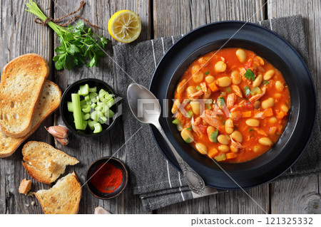 Pasulj, white bean soup with chicken in bowl Pasulj, white bean soup with chicken in bowl 121325332