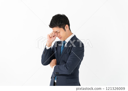 Businessman worried headache Businessman worried headache 121326009