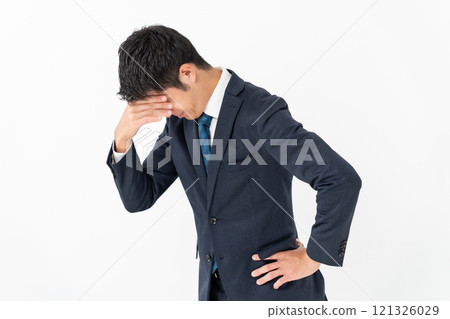 Businessman worried headache Businessman worried headache 121326029