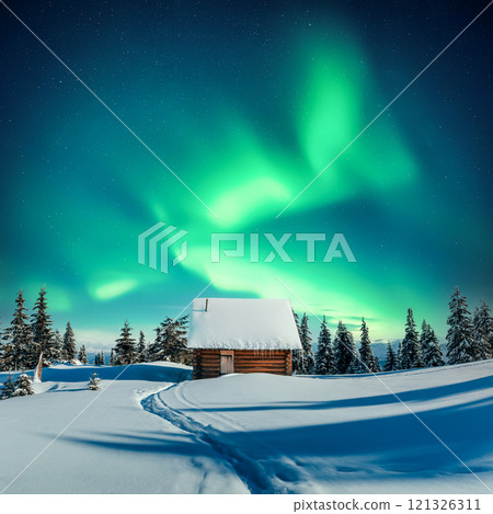 Old wooden cabin in snowy mountains under incredible Northern lights 121326311