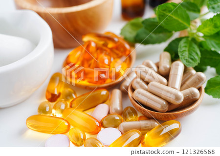 Alternative medicine herbal organic capsule with vitamin E omega 3 fish oil, mineral, drug with herbs leaf natural supplements for healthy good life. Alternative medicine herbal organic capsule with vitamin E omega 3 fish oil, mineral, drug with herbs leaf natural supplements for healthy good life. 121326568