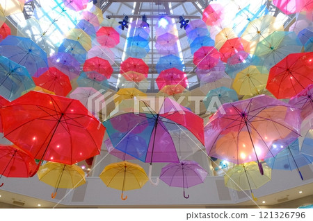Plastic umbrellas hanging from the ceiling Plastic umbrellas hanging from the ceiling 121326796