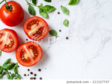 Fresh raw ripe red tomatoes with half and slice with basil and spices on white background.Top view.AI Generative. Fresh raw ripe red tomatoes with half and slice with basil and spices on white background.Top view.AI Generative. 121327747