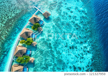 Aerial view of luxury resort stretching into the turquoise ocean Aerial view of luxury resort stretching into the turquoise ocean 121327950