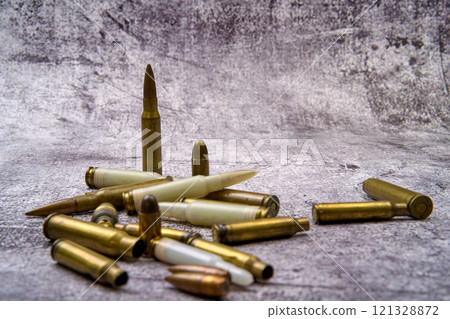 Composition of rounds of ammunition on floor 121328872