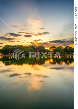 Hoan Kiem Lake ( Ho Guom) or Sword lake in the center of Hanoi in cinematic sunset sky. Hoan Kiem Lake ( Ho Guom) or Sword lake in the center of Hanoi in cinematic sunset sky. 121328916