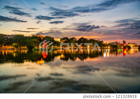 Hoan Kiem Lake ( Ho Guom) or Sword lake in the center of Hanoi in cinematic sunset sky. Hoan Kiem Lake ( Ho Guom) or Sword lake in the center of Hanoi in cinematic sunset sky. 121328918