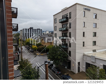 Portland, Oregon, USA - 10.04.2024: Rainy weather. Buildings in the Slabtown area of the city Portland, Oregon, USA - 10.04.2024: Rainy weather. Buildings in the Slabtown area of the city 121329453