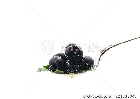 black olives in a spoon isolated on a white background black olives in a spoon isolated on a white background 121330002