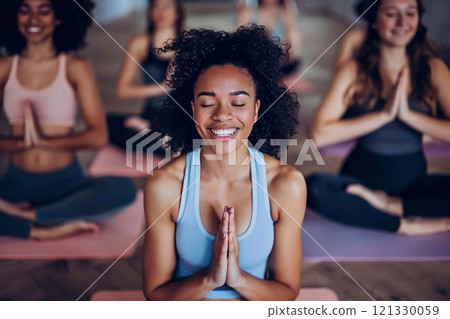 Young happy beautiful woman during yoga training in group class.Macro.AI Generative. 121330059