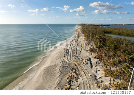 Hurricane Milton storm surge destroyed Manasota Key road at Blind Pass Beach. Severe damage to waterfront infrastructure in Florida. 121330137