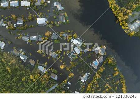 Heavy flood with high water surrounding residential houses after hurricane Ian rainfall in Florida residential area. Consequences of natural disaster 121330243