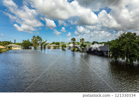 Flooded residential area with underwater houses from hurricane Debby rainfall water in Laurel Meadows community in Sarasota, Florida. Aftermath of natural disaster in southern USA Flooded residential area with underwater houses from hurricane Debby rainfall water in Laurel Meadows community in Sarasota, Florida. Aftermath of natural disaster in southern USA 121330334
