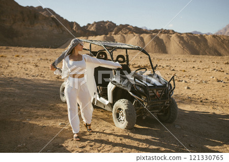 Woman tourist on quad bike ATV safari with desert background of Sharm El Sheikh Egypt Woman tourist on quad bike ATV safari with desert background of Sharm El Sheikh Egypt 121330765