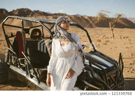 Woman tourist on quad bike ATV safari with desert background of Sharm El Sheikh Egypt Woman tourist on quad bike ATV safari with desert background of Sharm El Sheikh Egypt 121330768