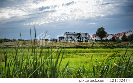 Amazing Countryside Landscape With Rural Houses Against A Cloudy Sky. Amazing Countryside 121332474