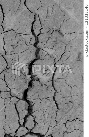 Texture Of Drying Up Dark Soil With Cracks Top View. Post Apocalyptic Contamination Illustrative Image 121333146