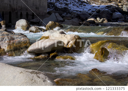 Rushing River Waters Over Rocks in a Pristine Natural Setting 121333375