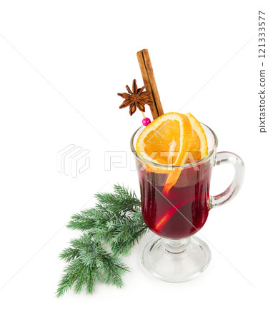 Hot red mulled wine with christmas spices, orange slice, anise and cinnamon sticks isolated on a white background. Vertical photo. Hot red mulled wine with christmas spices, orange slice, anise and cinnamon sticks isolated on a white background. Vertical photo. 121333577