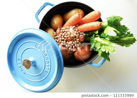 Image of healthy stewed food: Cast iron enamel pot on white background Image of healthy stewed food: Cast iron enamel pot on white background 121333999