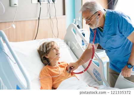 Sick child in hospital room. Kid in clinic ward. 121335372