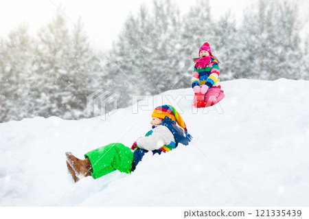 Girl on sled ride. Child sledding. Kid on sledge Girl on sled ride. Child sledding. Kid on sledge 121335439