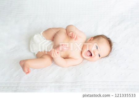 Little baby on white bed Little baby on white bed 121335533