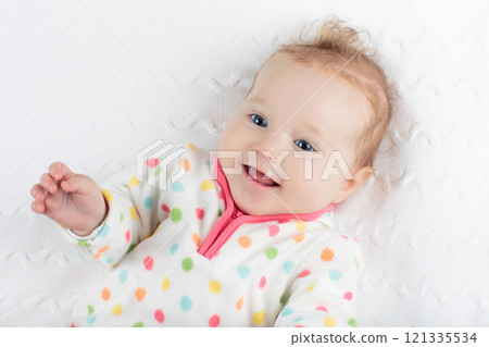 Little baby girl on colorful blanket Little baby girl on colorful blanket 121335534