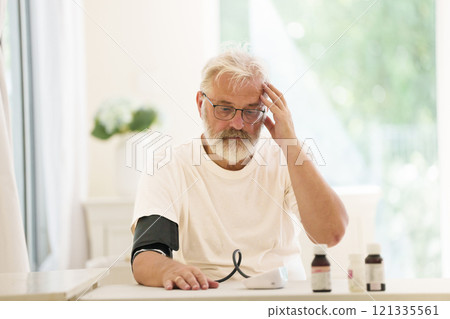 Senior man measuring blood pressure 121335561