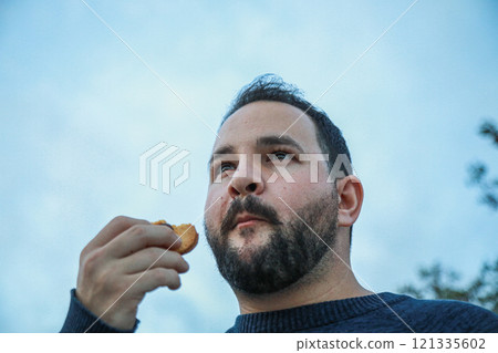Man Enjoys the Perfect Biscuit Bite 121335602