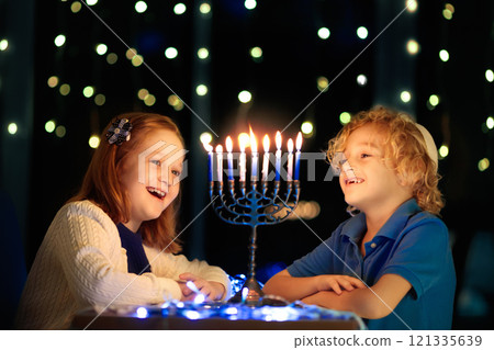 Kids celebrating Hanukkah. Festival of lights. 121335639